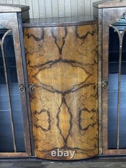 This Is an Asian walnut china cabinet, likely dating from the 1920s to 1930s. I