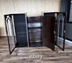 This Is an Asian walnut china cabinet, likely dating from the 1920s to 1930s. I