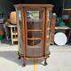 Vtg Antique Curved Glass Tiger Oak Curio Cabinet With Claw Feet & Wheels With Key