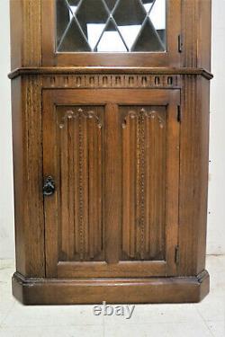 Vintage English Tiger Oak Linen Fold Corner Cabinet