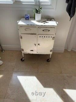 Vintage White Metal Rolling Medicine Cabinet