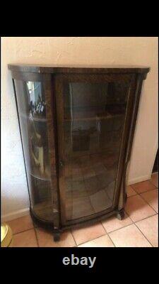 Vintage/antique curio cabinet with rounded glass
