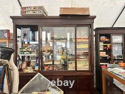 Vintage antique oak country store display cabinet 94 L x 25 D x 97 H 2 door