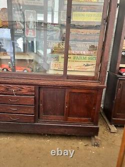 Vintage antique oak country store display cabinet 94 L x 25 D x 97 H 2 door