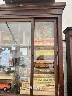 Vintage antique oak country store display cabinet 94 L x 25 D x 97 H 2 door