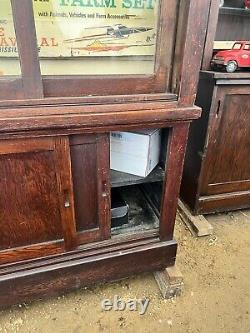 Vintage antique oak country store display cabinet 94 L x 25 D x 97 H 2 door