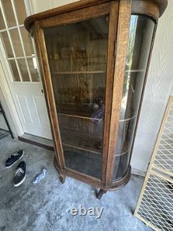 Vintage curved glass curio cabinet
