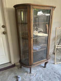 Vintage curved glass curio cabinet