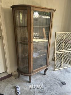 Vintage curved glass curio cabinet