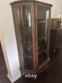 Vintage curved glass curio cabinet