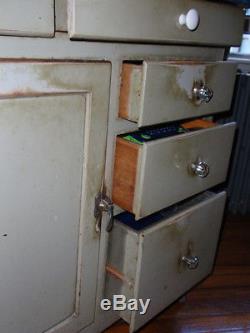 Vintage hoosier style kitchen cabinet by McDougall original green paint