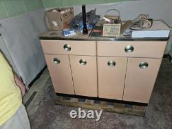 Vintage metal storage cabinet with drawers