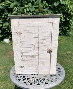 Wooden wall-hanging cabinet heavily crackled, chippy off-white paint antique