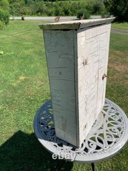 Wooden wall-hanging cabinet heavily crackled, chippy off-white paint antique