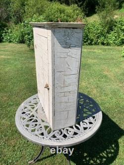 Wooden wall-hanging cabinet heavily crackled, chippy off-white paint antique