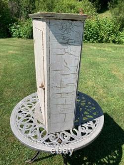 Wooden wall-hanging cabinet heavily crackled, chippy off-white paint antique